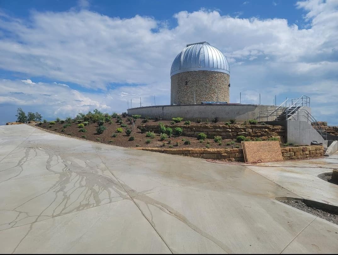 Full hillside landscape install surrounding a stone observatory